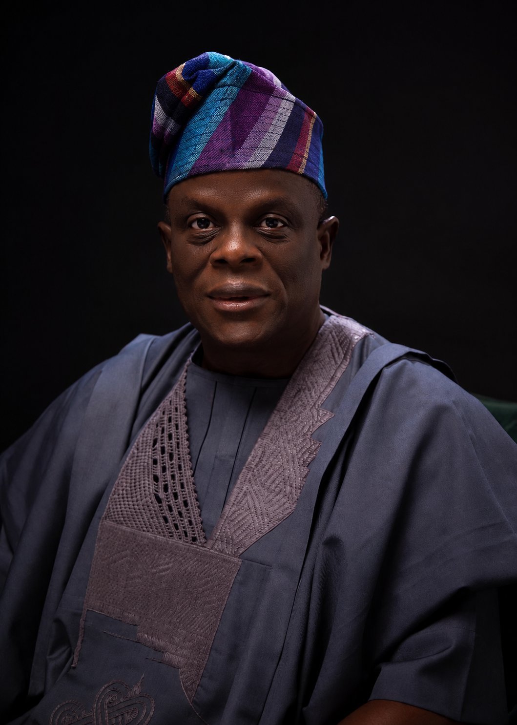 Portrait of Olu Akanmu in dark traditional attire